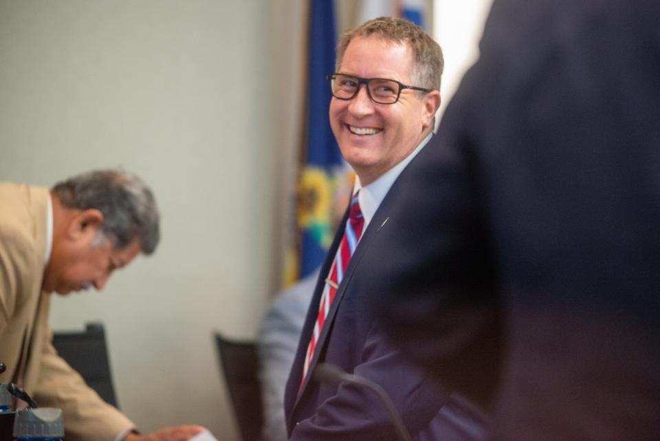 Stephen Wade smiles at Topeka City Council members after being named city manager.