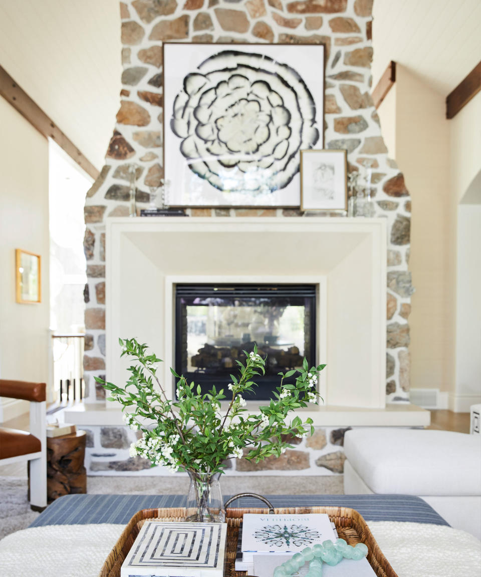 <p> When framing your fireplace, you can be both bold and subtle. Whether you build a bespoke wooden surround for added texture and height, or use clever paint ideas to enhance an original design, using techniques that frame your fireplace will ensure it becomes an elegant, eye-catching feature in your family room. </p> <p> In this large family room space, designed by Jessica Bennett of Alice Lane Interior Design, she states, 'we wanted this space to feel more dressed up and fashionable. We started with the design of the new fireplace surround, creating drama and adding more height to the space.' </p> <p> The large frame for this fireplace perfectly matches the height and grandeur of this space, with the soft cream paint used complementing the textured brickwork and natural palette used throughout the room. </p>