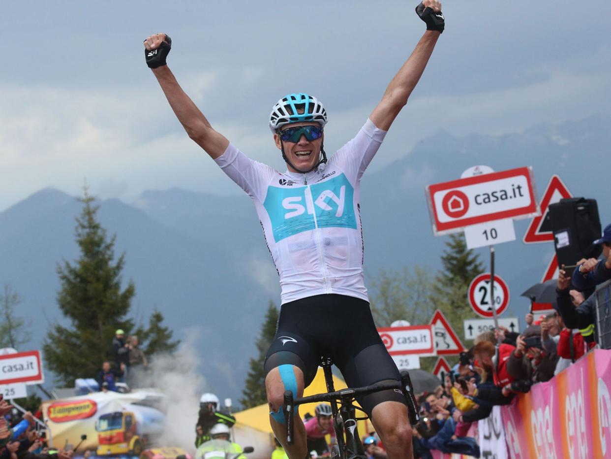 Chris Froome celebrates as he crosses the line in first place: Getty