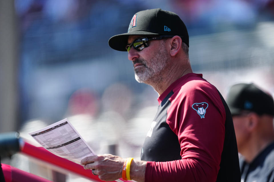 Arizona Diamondbacks manager Torey Lovullo watches from the dugout as his team plays the Atlanta Braves in a baseball game Sunday, April 7, 2024, in Atlanta. (AP Photo/John Bazemore)