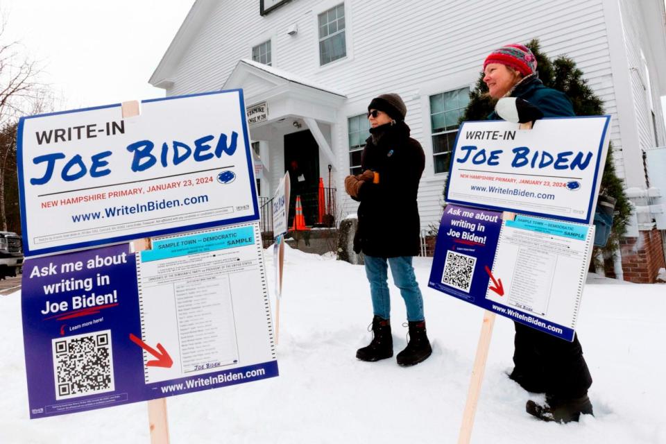 PHOTO: Supporters of a Pres. Joe Biden write-in campaign stand outside the Holderness Town Hall polling site during presidential primary election day, Jan. 23, 2024, in Holderness, N.H.  (Michael Dwyer/AP)