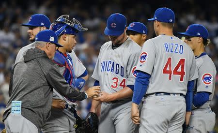 Oct 15, 2017; Los Angeles, CA, USA; Chicago Cubs manager Joe Maddon (70) relieves starting pitcher Jon Lester (34) in the fifth inning against the Los Angeles Dodgers during game two of the 2017 NLCS playoff baseball series at Dodger Stadium. Mandatory Credit: Richard Mackson-USA TODAY Sports