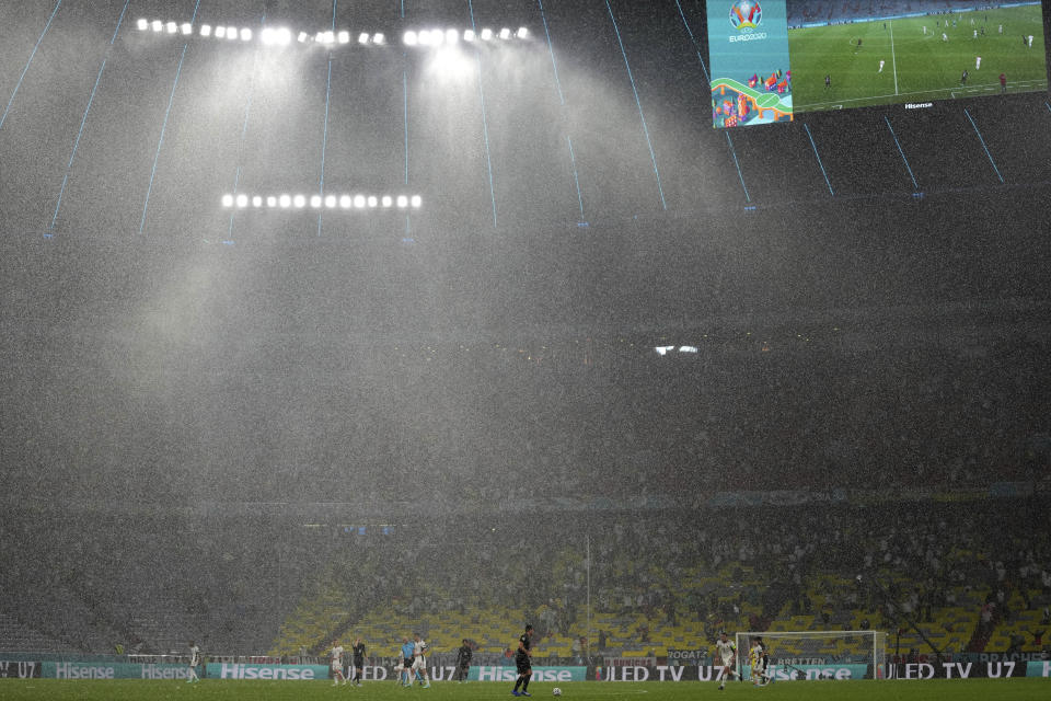 Heavy rain falls during the Euro 2020 soccer championship group F match between Germany and Hungary at the Allianz Arena in Munich, Germany,Wednesday, June 23, 2021. (AP Photo/Matthias Schrader, Pool)