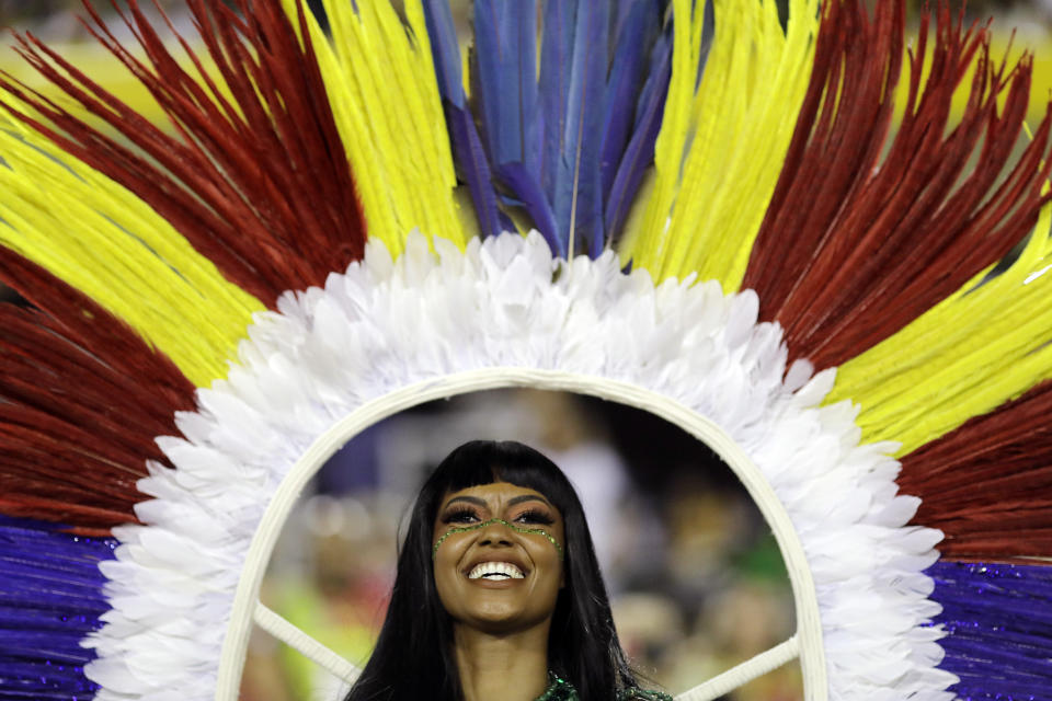 A performer from the Imperatriz Leopoldinense samba school takes part in Carnival. (Photo: Leo Correa/AP)