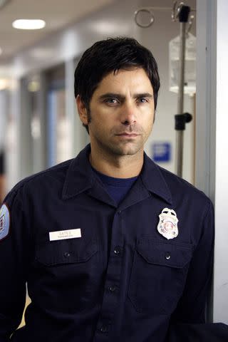 <p>Paul Drinkwater/NBCU Photo Bank</p> John Stamos as Paramedic Tony Gates on 'ER'.