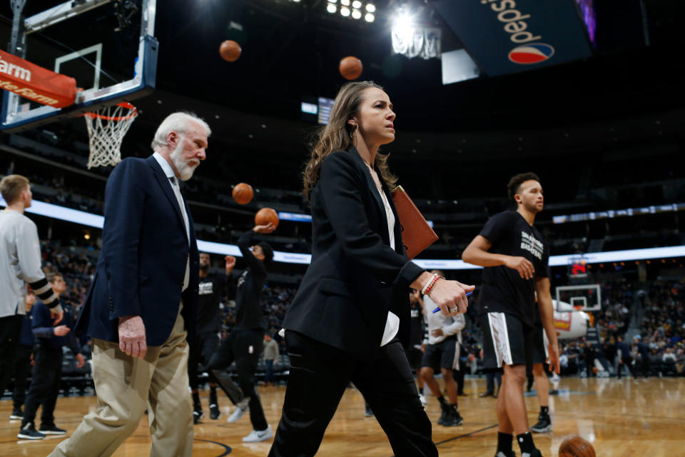 Assistant coach Becky Hammon and head coach Gregg Popovich on the court during a San Antonio Spurs game in 2017.<span class="copyright">David Zalubowski—AP</span>