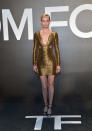 The model looks like she could keep up with the new faces in the gold mini dress.