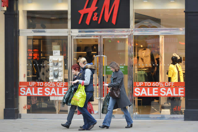 BATH - DEC 26: People walk past a H&M store in Southgate shopping district for the Boxing Day Sales on Dec 26, 2014 in Bath, UK.