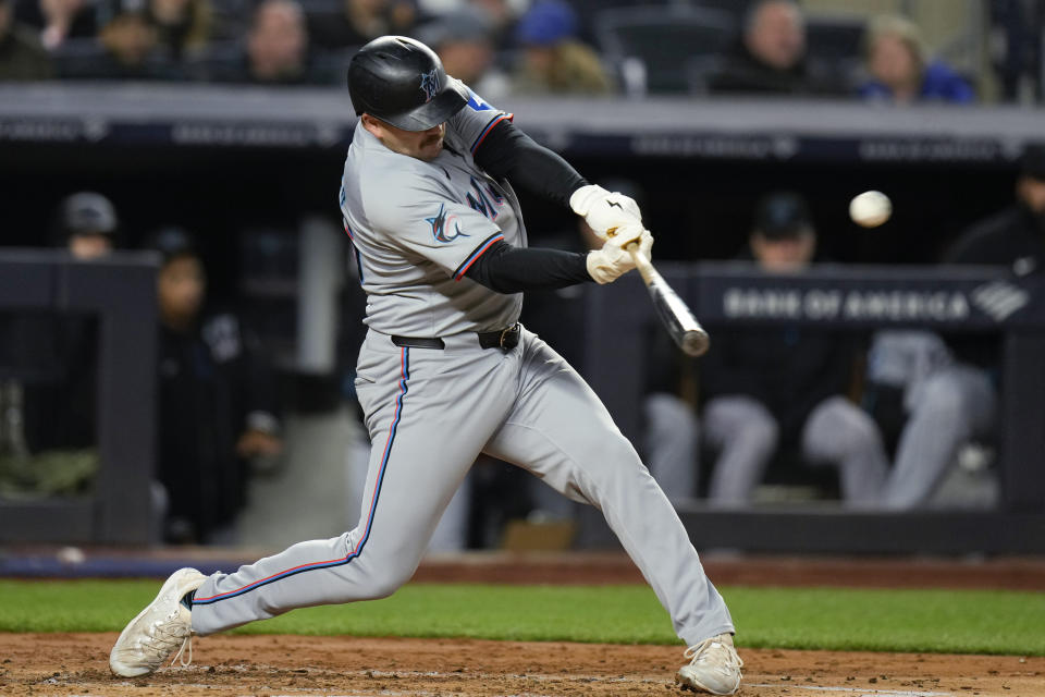 Miami Marlins' Jake Burger hits a three-run home run during the third inning of the team's baseball game against the New York Yankees at Yankee Stadium, Wednesday, April 10, 2024, in New York. (AP Photo/Seth Wenig)