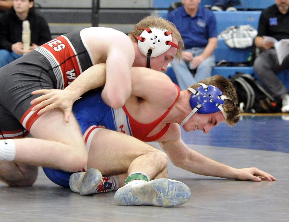 Andrew Sas of Mapleton is pinned by Wadsworth David Shue in the 138 pound match.