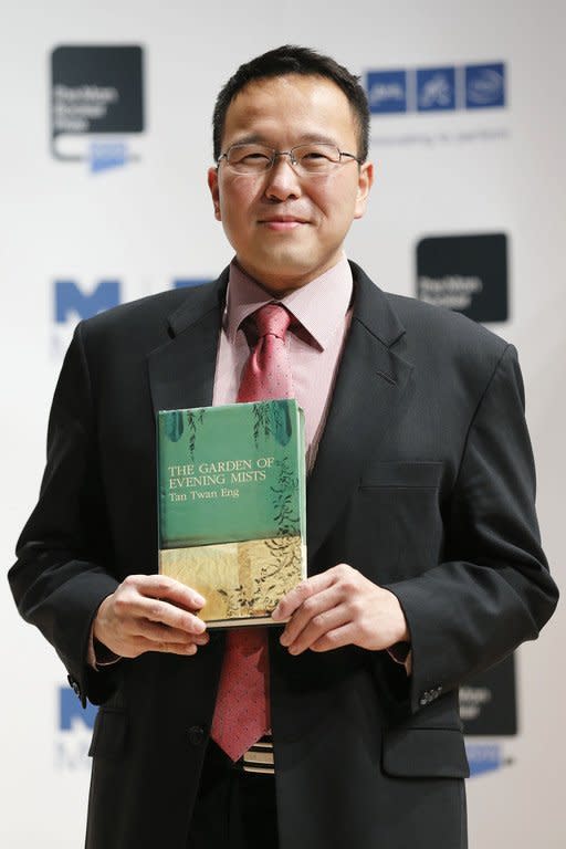 Malaysian author Tan Twan Eng holding his book "The Garden of Evening Mists" in London on October 15, 2012. A debut novel and a work by a Nobel laureate were among five books shortlisted for Asia's most prestigious literary prize on Wednesday, with entries across the region from Turkey to Japan