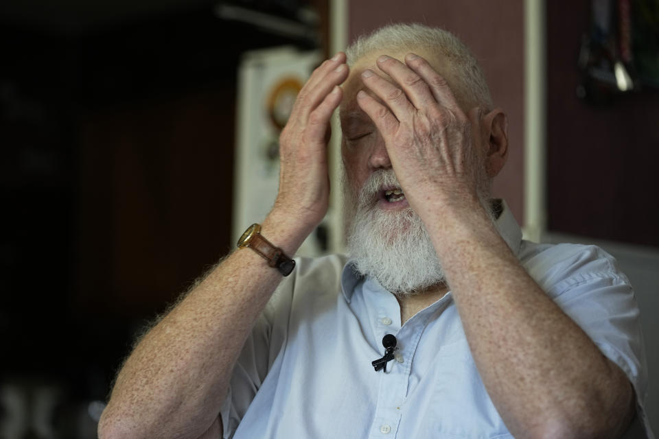 Dean Kahler, who was shot and paralyzed at Kent State University on May 4, 1970, recounts wiping tear gas from his eyes that day, during an interview in his home Thursday, May 2, 2024, in Plain Township, Ohio. (AP Photo/Sue Ogrocki)