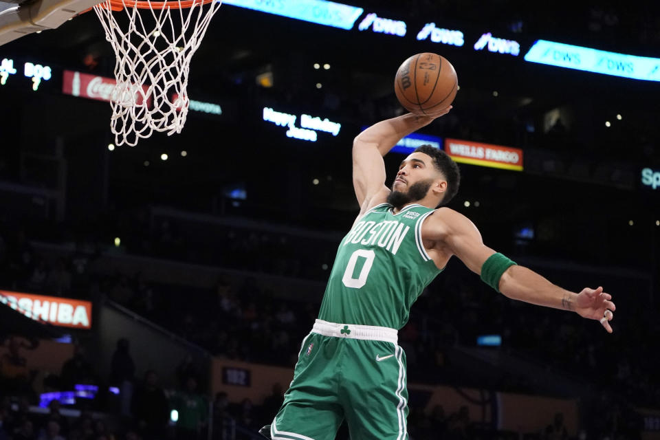 Boston Celtics forward Jayson Tatum goes up for a dunk during the first half of the team's NBA basketball game against the Los Angeles Lakers on Tuesday, Dec. 7, 2021, in Los Angeles. (AP Photo/Marcio Jose Sanchez)