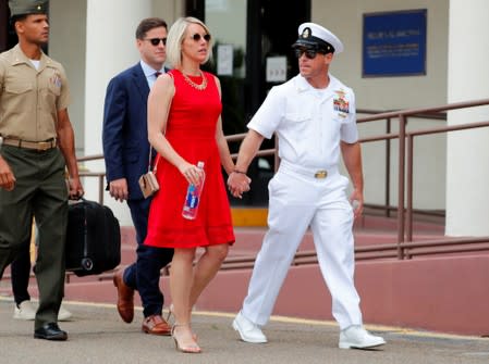 U.S. Navy SEAL Special Operations Chief Edward Gallagher leaves court with his wife after the first day of jury selection at the court-martial trial at Naval Base San Diego