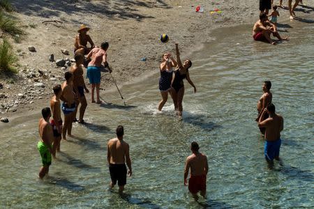 People cool off in the Cijevna river near Tuzi as a heatwave hits Montenegro, August 4, 2017. REUTERS/Stevo Vasiljevic