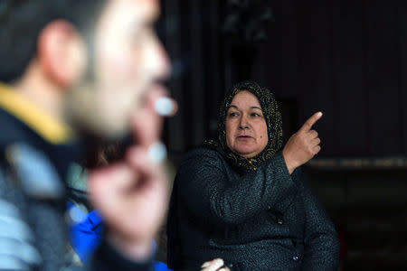 A woman whose son says he is fighting alongside Islamic State militants, speaks during an interview at her home in Qayyara, Iraq, December 6, 2016. Picture taken December 6, 2016. REUTERS/Alaa Al-Marjani