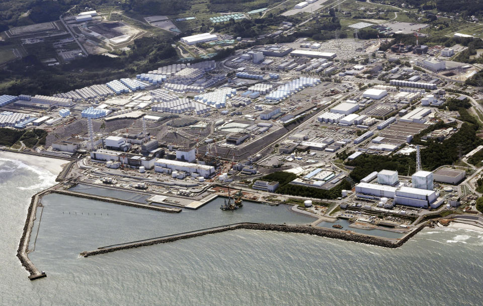 This aerial view shows the Fukushima Daiichi nuclear power plant in Fukushima, northern Japan, Thursday, Aug. 24, 2023, shortly after its operator Tokyo Electric Power Company Holdings TEPCO began releasing its first batch of treated radioactive water into the Pacific Ocean — a controversial step, but a milestone for Japan’s battle with the growing radioactive water stockpile.(Kyodo News via AP)