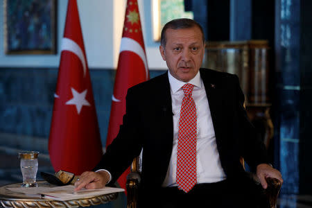 Turkish President Tayyip Erdogan attends an interview with Reuters at the Presidential Palace in Ankara, Turkey, April 25, 2017. REUTERS/Umit Bektas