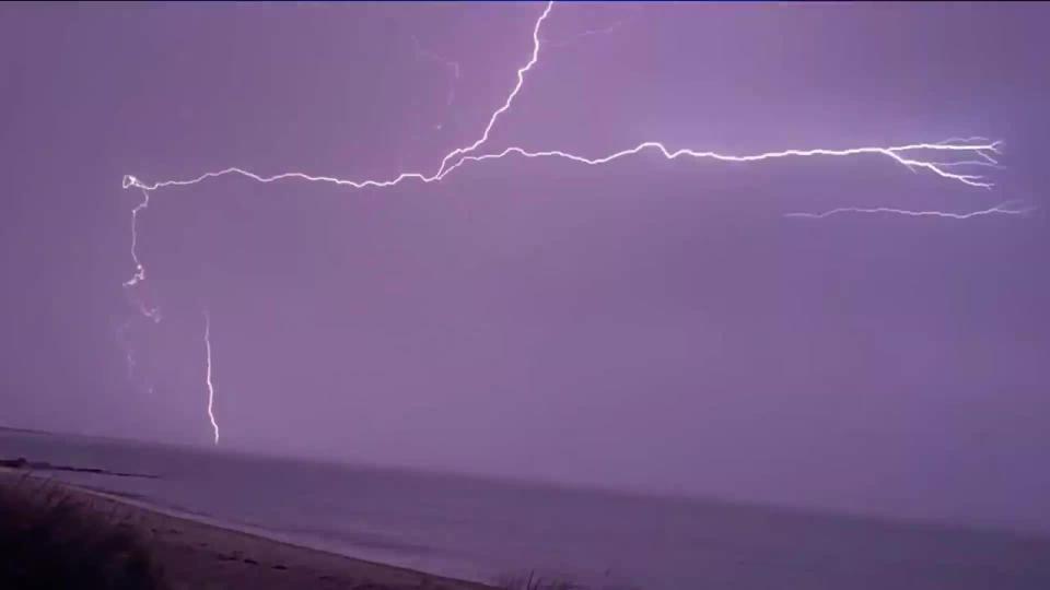 Massive bolts of lightning illuminate night sky over Cape Cod