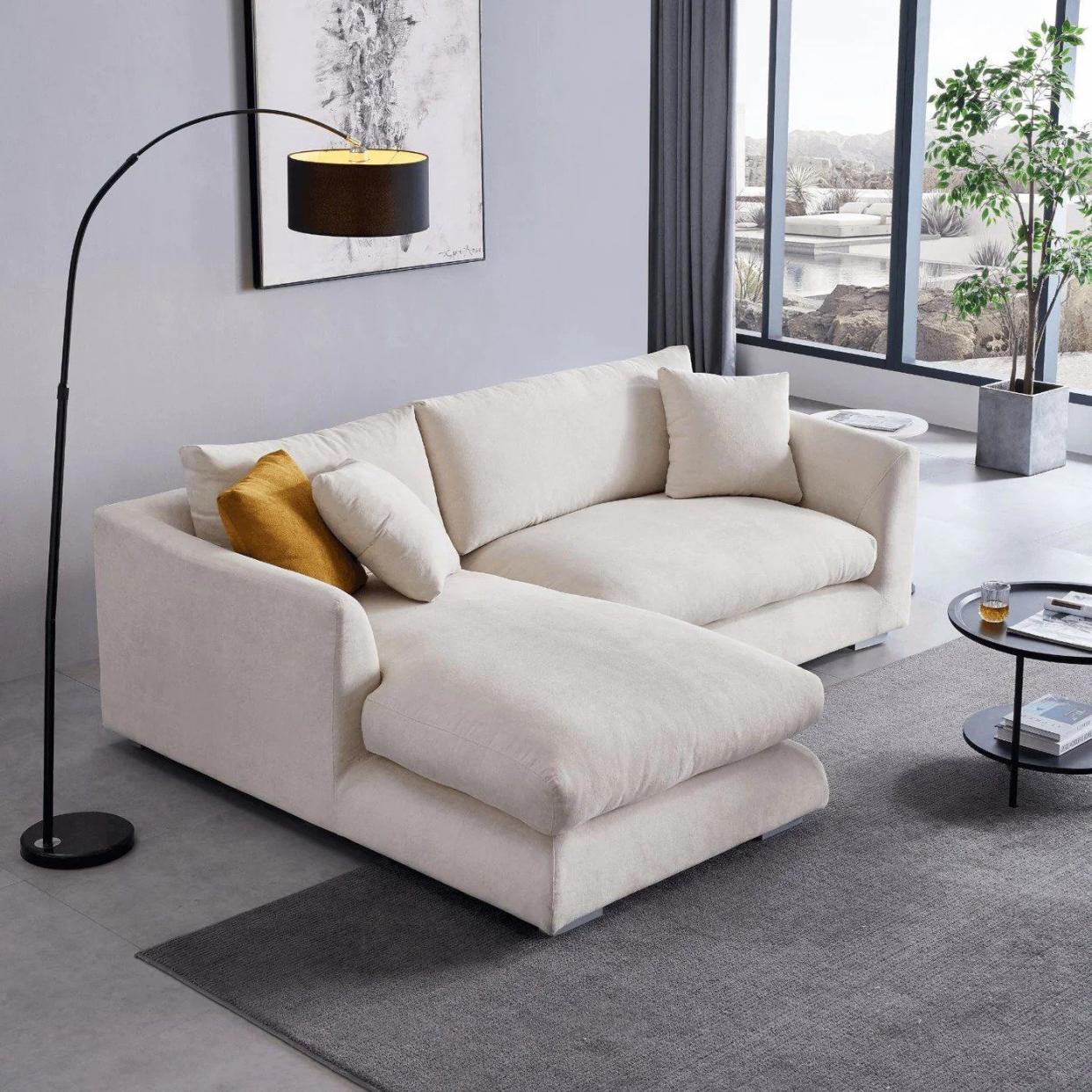 <p><a href="https://go.redirectingat.com?id=74968X1596630&url=https%3A%2F%2Fvalyoufurniture.com%2Fproducts%2Ffeathers-sectional&sref=https%3A%2F%2Fwww.cosmopolitan.com%2Flifestyle%2Fg40108551%2Fbest-sectionals-for-small-spaces%2F" rel="nofollow noopener" target="_blank" data-ylk="slk:Shop Now;elm:context_link;itc:0;sec:content-canvas" class="link rapid-noclick-resp">Shop Now</a></p><p>Feathers Sectional</p><p>valyoufurniture.com</p><p>$1499.95</p>