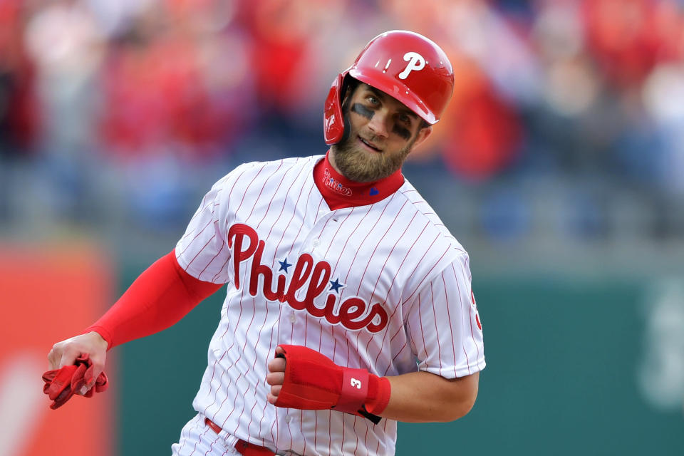 PHILADELPHIA, PA - MARCH 28: Bryce Harper #3 of the Philadelphia Phillies rounds the bases to score a run on a grand slam home run by Rhys Hoskins #17 during the game against the Atlanta Braves on Opening Day at Citizens Bank Park on March 28, 2019 in Philadelphia, Pennsylvania. (Photo by Drew Hallowell/Getty Images)