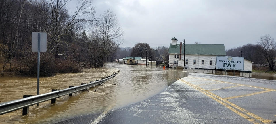 Floodwaters cover a road Friday, Feb. 17, 2023, in Pax, W.Va. The flooding came amid a string of thunderstorms that swept across the South. (Bob Aaron/WCHS-TV via AP)