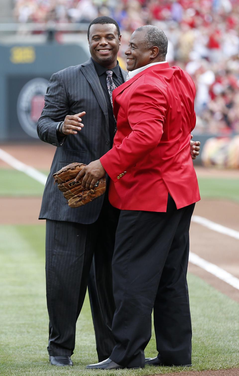 Reds Hall of Famer Ken Griffey Sr. (right) embraces his son, Ken Jr., during his son's Reds Hall of Fame induction ceremony.