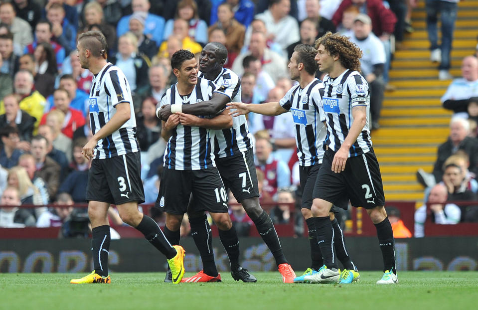 Newcastle United's Hatem Ben Arfa is congratulated on scoring his sides opening goal during the Barclays Premier League match at Villa Park, Birmingham.