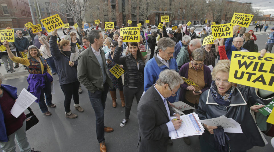 People gather for Republican U.S. Rep. Chris Stewart town hall Friday, March 31, 2017, in Salt Lake City. This is the first of the state's congressional delegation since Rep. Jason Chaffetz was shouted down by a cacophony of boos. Progressive activists who say they're worried about President Donald Trump's policies plan to have several hundred people in attendance, but it's unclear if the Stewart event will reach the same level of discord that Chaffetz faced in February. (AP Photo/Rick Bowmer)