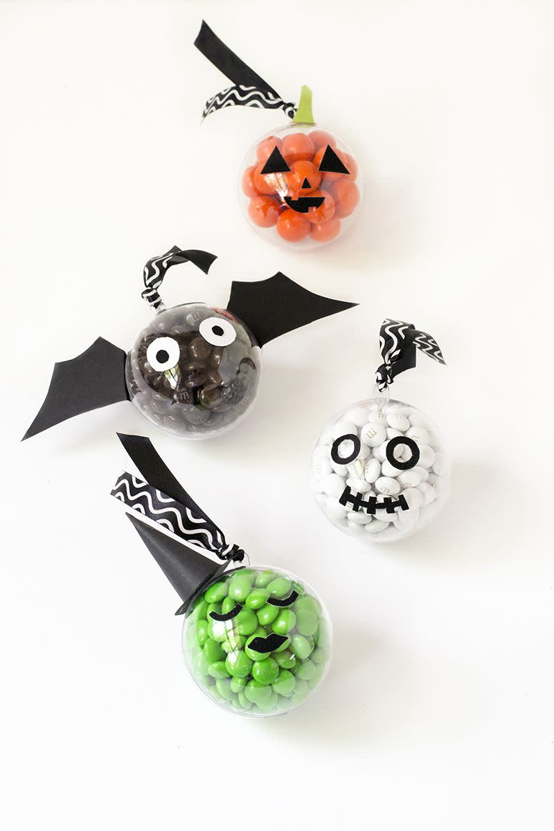 <p>Have the kids stuff clear baubles with candy, and then, let them decorate 'em with stickers. To make this more of a game and less of a craft, time them to see who can get theirs done the fastest. </p><p><em><a href="https://makeandtell.com/en-us/blogs/blog/halloween-candy-baubles" rel="nofollow noopener" target="_blank" data-ylk="slk:Lear more at Make and Tell »;elm:context_link;itc:0;sec:content-canvas" class="link ">Lear more at Make and Tell »</a></em> </p><p><a class="link " href="https://www.amazon.com/Sweetfamily-Ornaments-Christmas-Decorations-Transparent/dp/B08L6DS2PX/?tag=syn-yahoo-20&ascsubtag=%5Bartid%7C10055.g.2618%5Bsrc%7Cyahoo-us" rel="nofollow noopener" target="_blank" data-ylk="slk:SHOP CLEAR BAUBLES;elm:context_link;itc:0;sec:content-canvas">SHOP CLEAR BAUBLES</a></p>