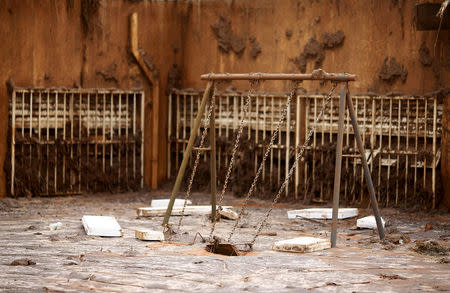 FILE PHOTO - The swings of the municipal school of Bento Rodrigues district which was covered with mud after a dam, owned by Vale SA and BHP Billiton Ltd burst, are pictured in Mariana, Brazil, November 9, 2015. REUTERS/Ricardo Moraes/File Photo