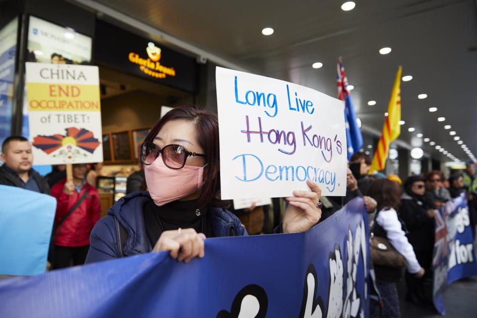 Pro-democracy demonstrators outside the State Library of Victoria in Melbourne, Australia (EPA)