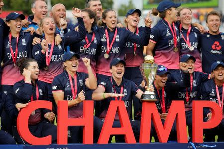 England's players celebrate winning the world cup with the trophy Action Images via Reuters/Andrew Couldridge