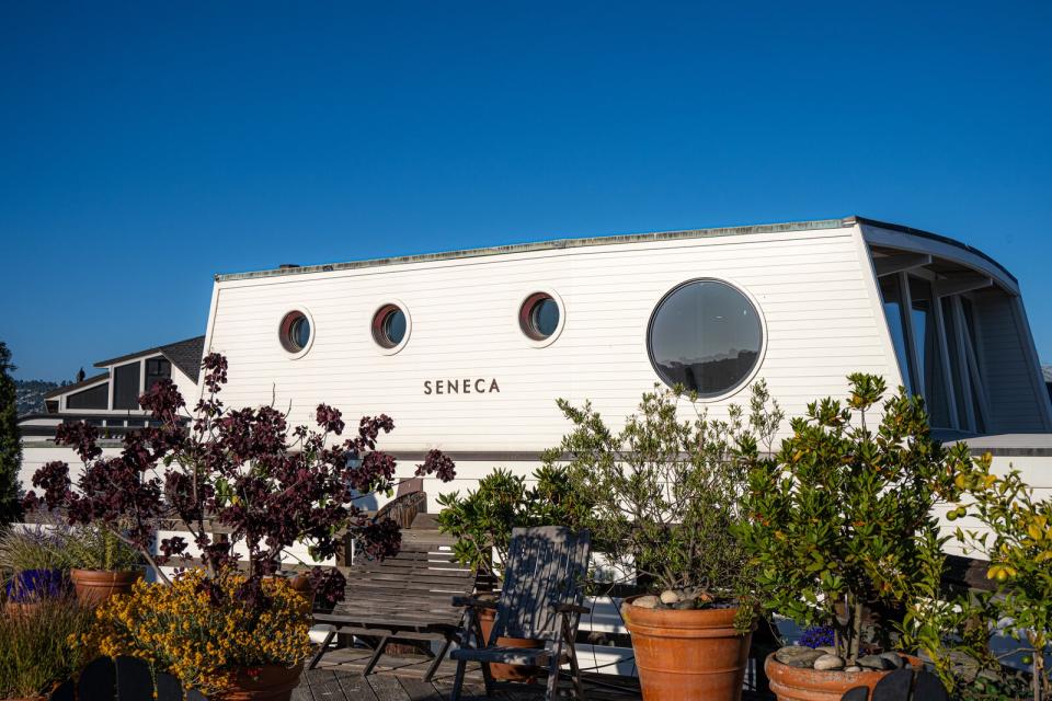 The floating home, originally constructed in 1968 by Forbes Kiddoo, that Marka Hansen and Joe Brubaker recreated with designer Michelle Chan and builder Steve Crutchfield of True North Construction bobs in a berth at the historical Waldo Point Harbor in Sausalito, California, just north of San Francisco and the Golden Gate Bridge.