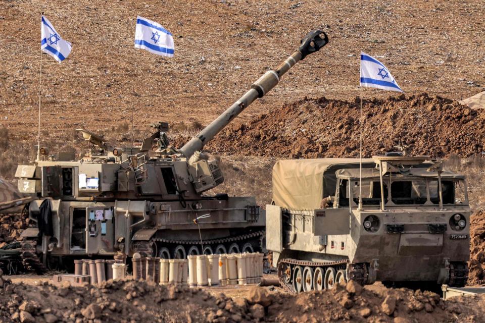 An Israeli army M109 155mm self-propelled howitzer is deployed at a position along the border with the Gaza Strip near Sderot (AFP via Getty Images)