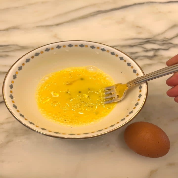 Beaten eggs in a bowl