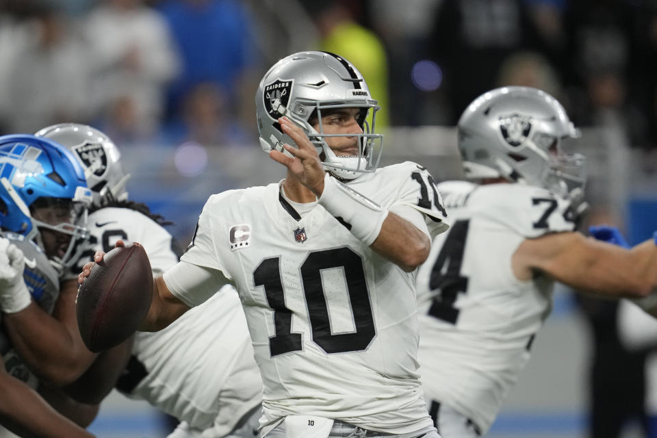 Las Vegas Raiders quarterback Jimmy Garoppolo throws during the first half of an NFL football game against the Detroit Lions, Monday, Oct. 30, 2023, in Detroit. (AP Photo/Paul Sancya)