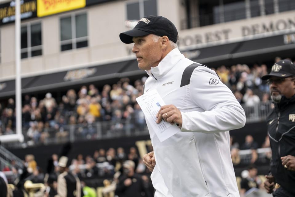 Wake Forest coach Dave Clawson runs onto the field before a game against Duke on Oct. 30.