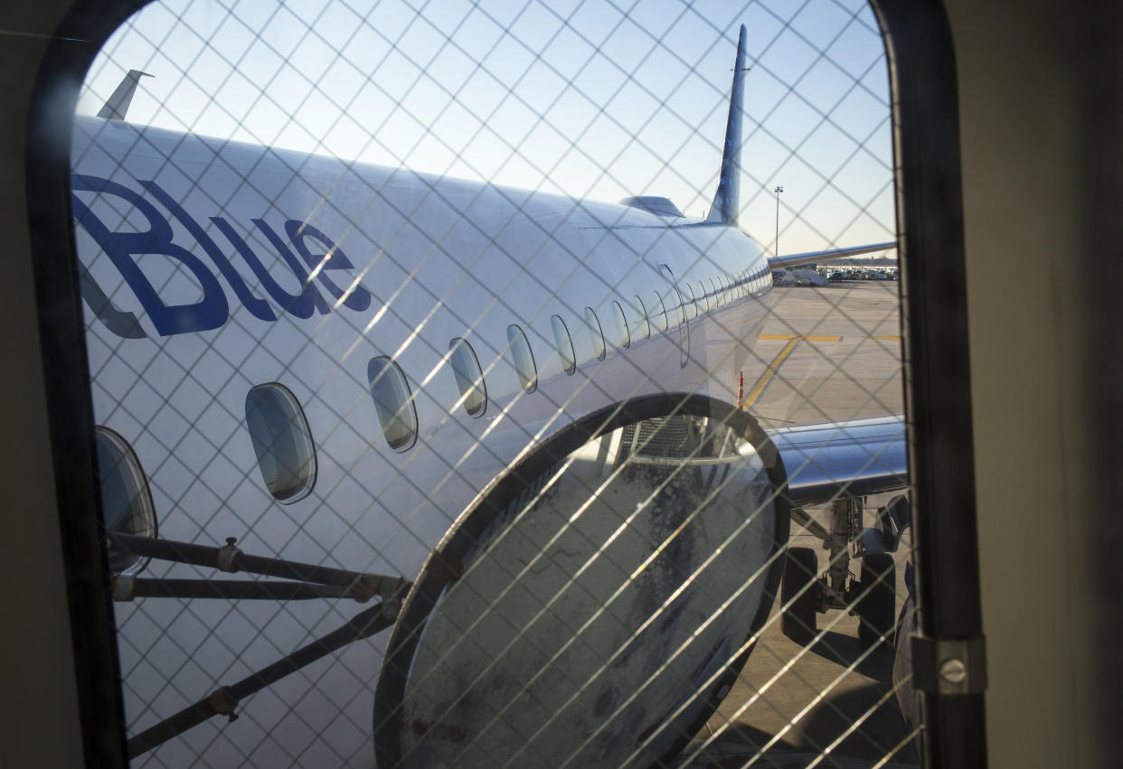 NEW YORK, NY -  APRIL 1: Passengers board a JetBlue Airways plane April 1, 2014 at John F Kennedy International Airport in Queens, New York. (Photo by Robert Nickelsberg/Getty Images)