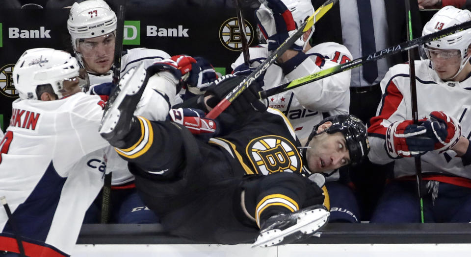 Washington’s Alex Ovechkin just wanted Boston’s Zdeno Chara to meet his teammates during first period action on Thursday night. (AP Photo/Elise Amendola)