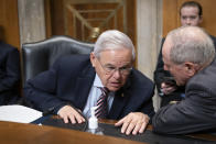 Senate Foreign Relations Committee Chairman Robert Menendez, D-N.J., left, confers with Sen. Jim Risch, R-Idaho, the ranking member, as the panel hears from State Department officials on U.S. efforts to assist Ukraine in the war with Russia, at the Capitol in Washington, Thursday, May 12, 2022. (AP Photo/J. Scott Applewhite)