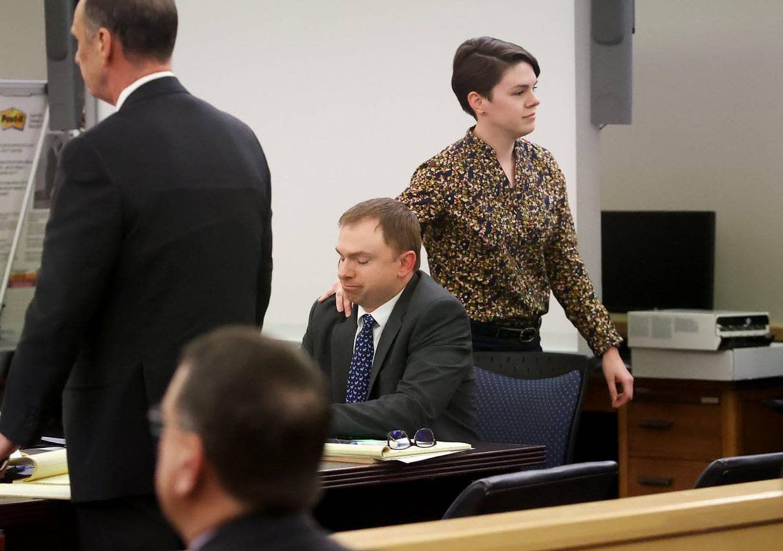 Alyssa Dean, Aaron Dean’s sister, touches his shoulder while returning to her seat after giving testimony during the sentencing phase of her brother’s trial in Tarrant County’s 396th District Court on Friday, December 16, 2022, in Fort Worth. Dean was found guilty of manslaughter in the shooting death of Atatiana Jefferson in 2019.