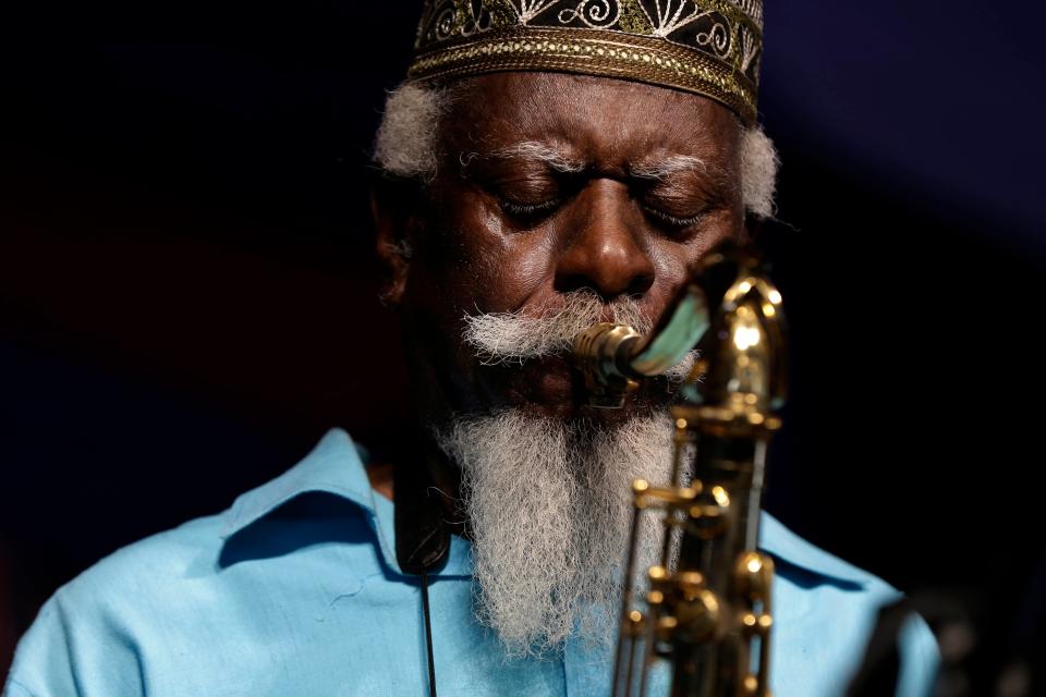 Jazz saxophonist Pharaoh Sanders performs at the New Orleans Jazz and Heritage Festival in 2014. The influential tenor saxophonist revered in the jazz world for the spirituality of his wor, has died, his record label announced Saturday. He was 81.