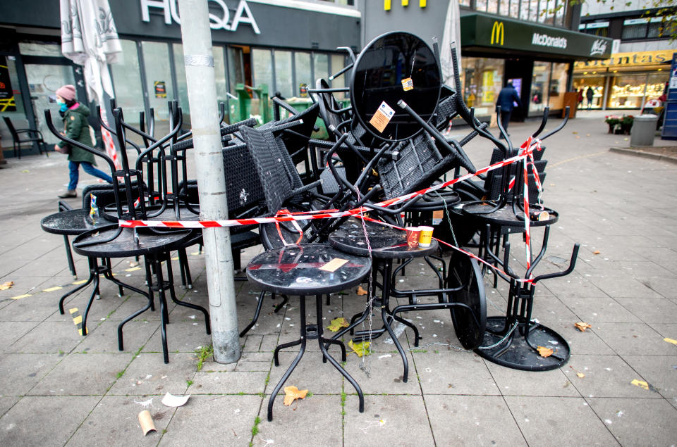 28 November 2020, Lower Saxony, Hanover: Tables and chairs are placed in front of a closed restaurant in the city centre. The federal and state governments have decided on a partial lockdown. Restaurants, bars and pubs must remain closed. Photo: Hauke-Christian Dittrich/dpa (Photo by Hauke-Christian Dittrich/picture alliance via Getty Images)