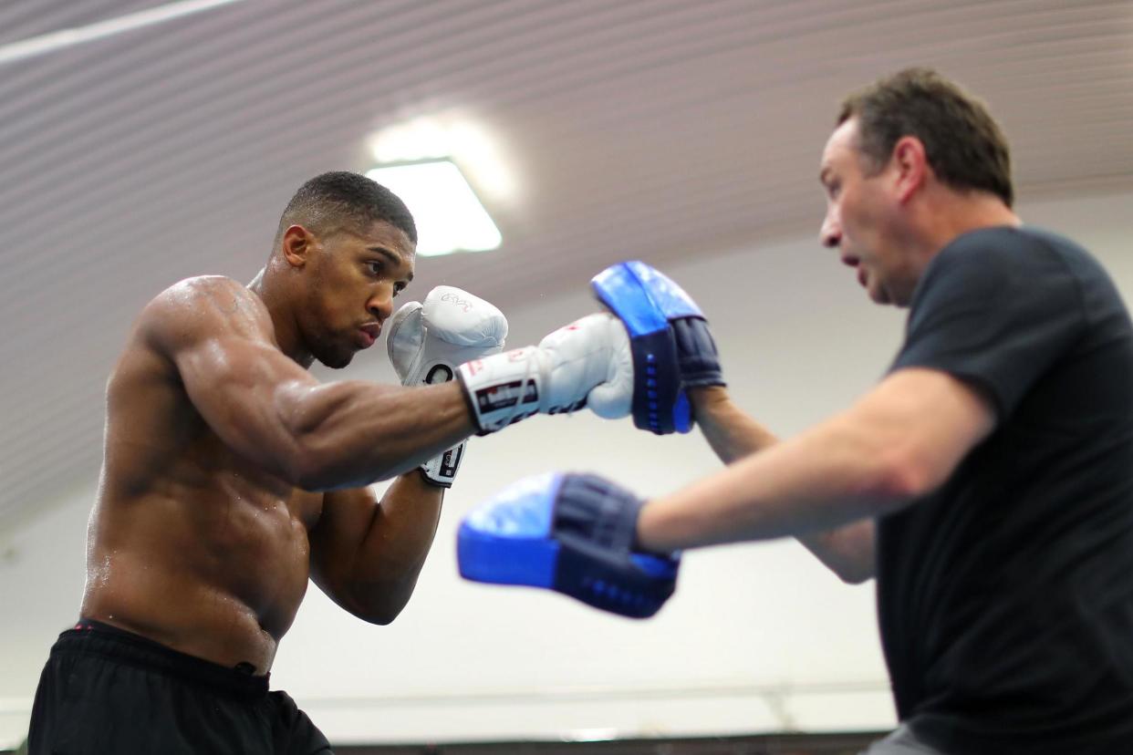 The hit man: Anthony Joshua, training with Rob McCracken, is not taking stand-in opponent Carlos Takam lightly: Getty Images