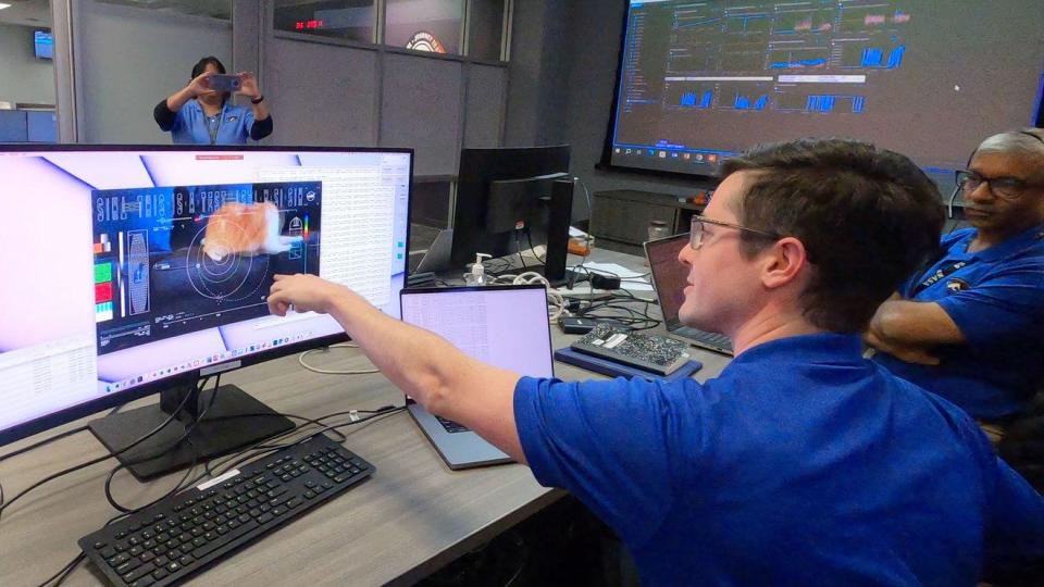 Members of NASA's Deep Space Optical Communications team react to the video of Taters. The high-definition streaming video was sent to Earth via laser from deep space. / Credit: NASA/JPL-Caltech