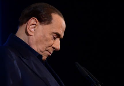 FILE PHOTO: Italy's former Prime Minister Silvio Berlusconi gestures as he speaks during a pre-election gathering in Milan, Italy February 25, 2018.  REUTERS/Massimo Pinca/File Photo