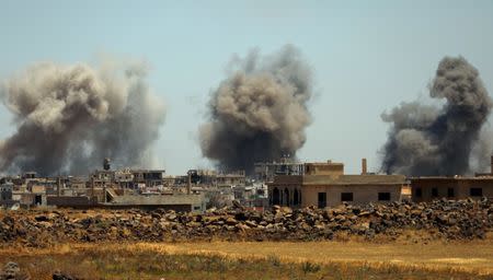 Smoke rises from al-Harak town, as seen from Deraa countryside, Syria June 25, 2018. REUTERS/Alaa al-Faqir