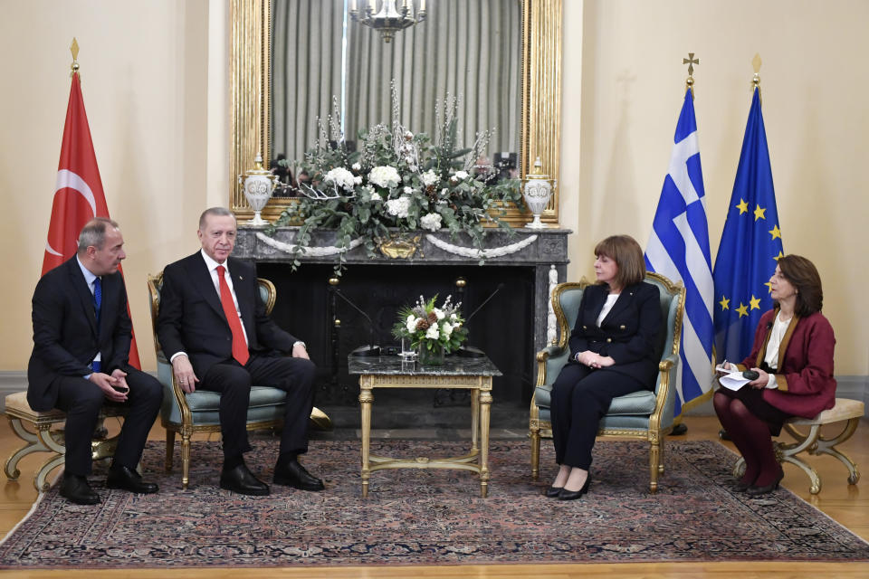 Greece's President Katerina Sakellaropoulou, second from right, speaks with her Turkish counterpart Recep Tayyip Erdogan, second from left, during their meeting at the Presidential Palace in Athens, Greece, Thursday, Dec. 7, 2023. Erdogan arrived in Greece on a visit designed to set the historically uneasy neighbors on a more constructive path and help repair strained his country's strained relationship with the European Union. (AP Photo/Michael Varaklas)