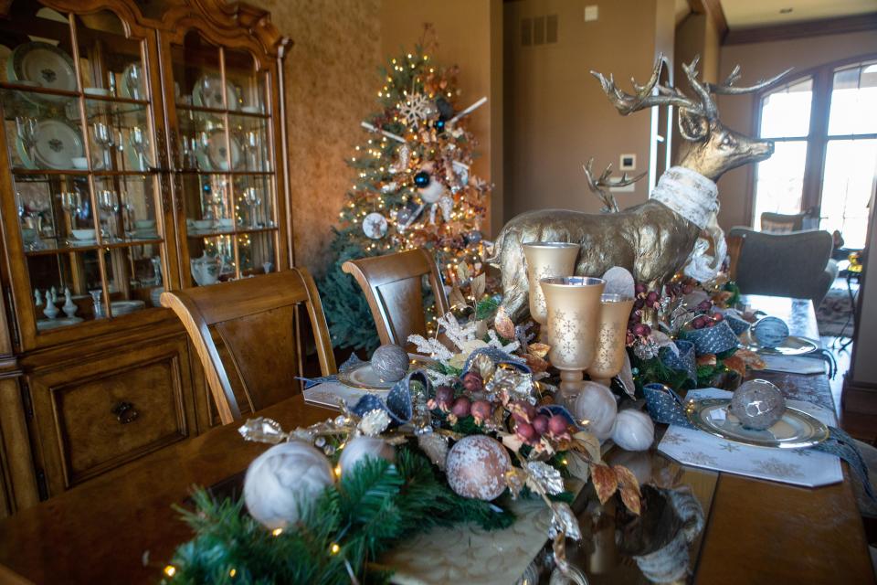 Designer Lori McNorton used candles and Judy Pleviak's two large golden deer to adorn the formal dining room table in the Pleviaks' home while decorating it for the 2020 CASA Homes for the Holidays tour. Last year's tour was canceled and switched to a virtual format due to COVID-19. The Pleviak home will be featured again this year as part of the Homes for the Holidays tour.